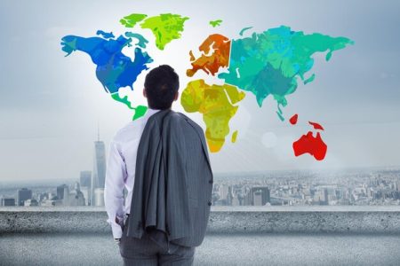 businessman-looking-colorful-map-with-city-background_1134-35743
